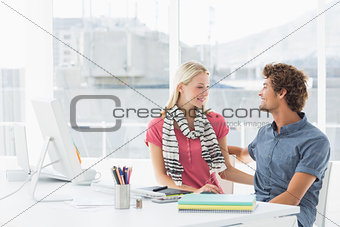 Casual business couple in a bright office