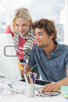 Casual couple using computer