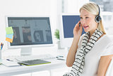 Casual young woman with headset in office