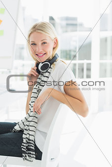 Casual young woman with headset at office