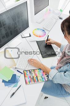 Artist drawing something on graphic tablet