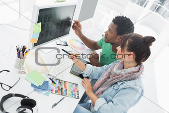 Two artists working on computer at the office
