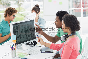 Casual people working on computers in office