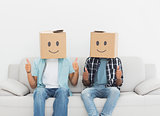 Men with happy smiley boxes over faces gesturing thumbs up