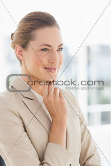 Closeup of a young businesswoman looking away