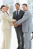 Portrait of business team joining hands together