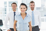 Confident smiling business team in office