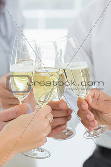 Hands toasting with champagne