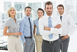 Confident business team together in office