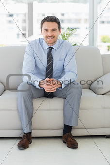 Portrait of a well dressed young man at home