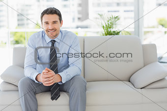 Portrait of a well dressed young man at home
