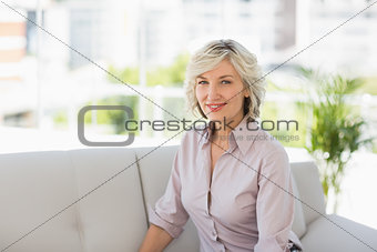 Portrait of a mature woman sitting at home