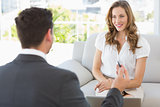 Smiling woman in meeting with a financial adviser