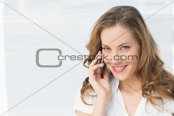 Closeup of a beautiful businesswoman using cellphone