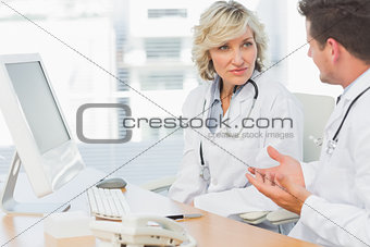 Doctors in discussion at medical office