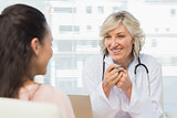 Friendly female doctor in conversation with patient