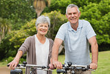 Senior couple on cycle ride at park