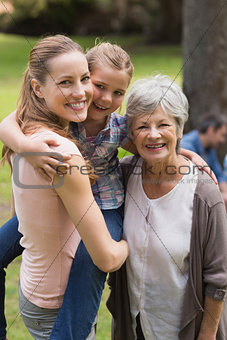 Portrait of grandmother, mother and daughter at park