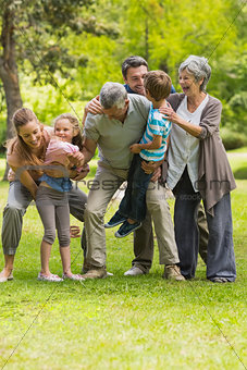Extended family playing in park