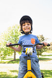 Cute little boy riding a bicycle