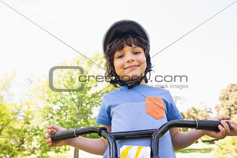Cute little boy riding a bicycle