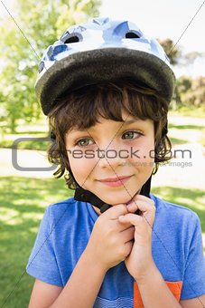 Cute little boy wearing bicycle helmet
