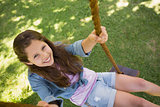 Cute little young girl sitting on swing