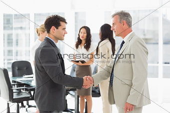 Businessmen meeting and shaking hands