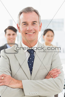 Mature businessman smiling at camera