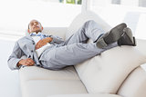 Businessman napping on the couch