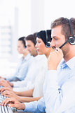 Business colleagues with headsets in a row