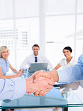 Closeup of a handshake in business meeting