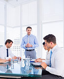 Executives sitting around conference table