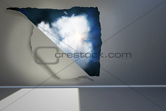 Rip on wall showing cloud graphic