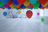 Many colourful balloons in room with city scene