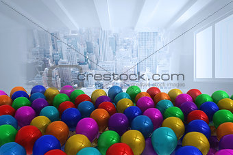 Many colourful balloons in room with city scene