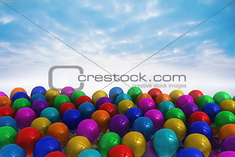Many colourful balloons against sky