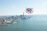 Many colourful balloons above coast