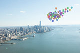 Many colourful balloons above coast