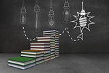 Steps made of books in front of light bulb doodle