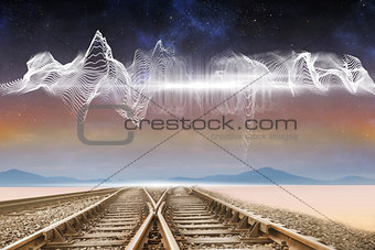 Train tracks under energy wave in desert
