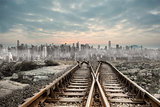 Railway tracks leading to big city