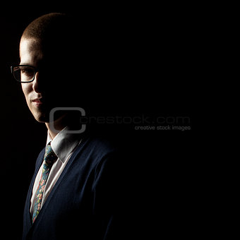 Studio low key portrait of a young man
