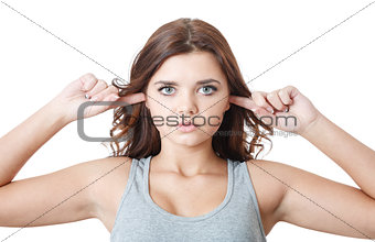 young female putting fingers in ears