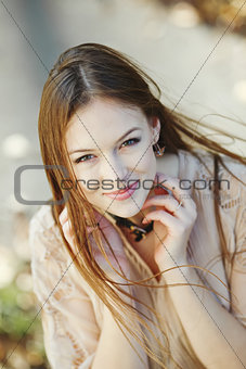 Portrait of a beautiful  young  caucasian woman outdoor.