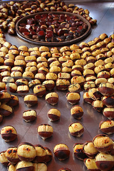 Delicious grilled chestnuts as background