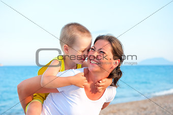 son hugging his mother on holiday
