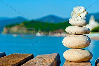 construction of smooth stones on a wooden pier
