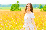 young woman in yellow flower field