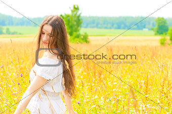 woman with long hair in field